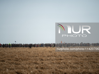 Protesters are marching during a demonstration against the construction of a giant water reservoir (mega-bassine) in Migne-Auxances, western...