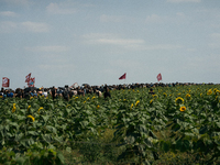 Protesters are marching during a demonstration against the construction of a giant water reservoir (mega-bassine) in Migne-Auxances, western...