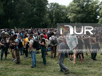 Demonstrators are picnicking before the start of a march as part of a rally against the construction of a giant water reservoir (mega-bassin...