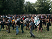 Demonstrators are picnicking before the start of a march as part of a rally against the construction of a giant water reservoir (mega-bassin...