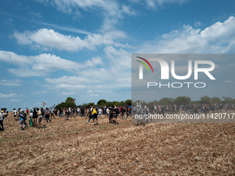 Protesters are marching during a demonstration against the construction of a giant water reservoir (mega-bassine) in Migne-Auxances, western...