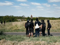 Protesters are marching during a demonstration against the construction of a giant water reservoir (mega-bassine) in Migne-Auxances, western...