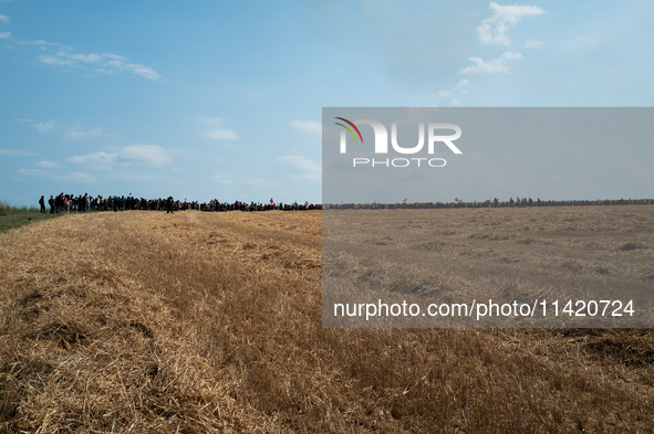 Protesters are marching during a demonstration against the construction of a giant water reservoir (mega-bassine) in Migne-Auxances, western...