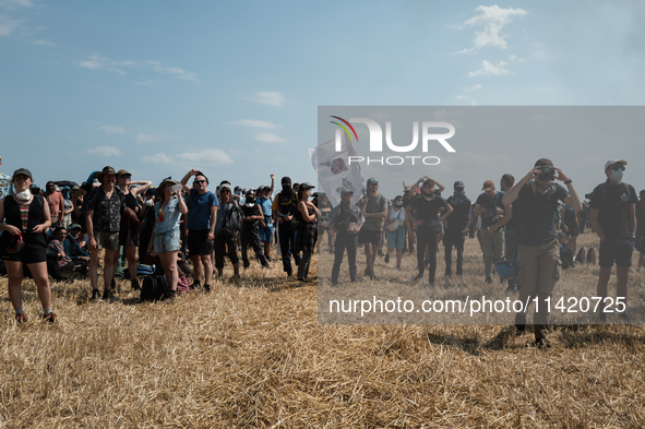 Protesters are marching during a demonstration against the construction of a giant water reservoir (mega-bassine) in Migne-Auxances, western...