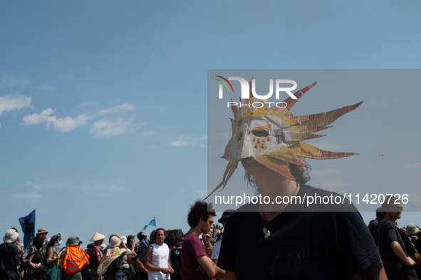 Protesters are marching during a demonstration against the construction of a giant water reservoir (mega-bassine) in Migne-Auxances, western...