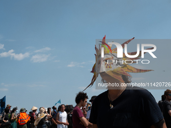 Protesters are marching during a demonstration against the construction of a giant water reservoir (mega-bassine) in Migne-Auxances, western...