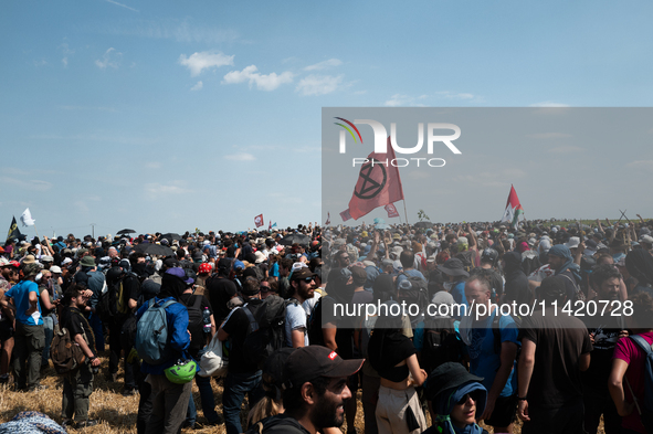 Protesters are marching during a demonstration against the construction of a giant water reservoir (mega-bassine) in Migne-Auxances, western...