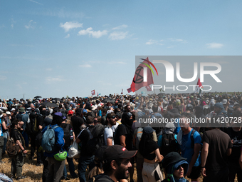 Protesters are marching during a demonstration against the construction of a giant water reservoir (mega-bassine) in Migne-Auxances, western...