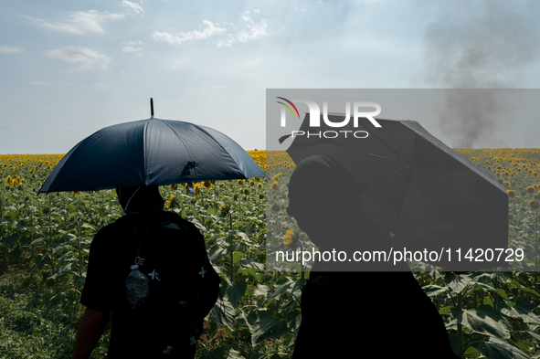 Protesters are marching during a demonstration against the construction of a giant water reservoir (mega-bassine) in Migne-Auxances, western...