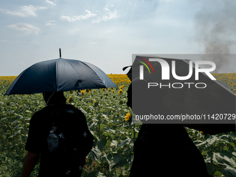 Protesters are marching during a demonstration against the construction of a giant water reservoir (mega-bassine) in Migne-Auxances, western...