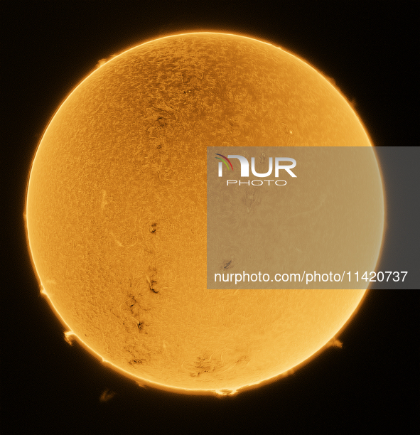 (EDITOR'S NOTE: This image was captured with an H-Alpha solar telescope and is the result of stacking 200 exposures. The final stacked image...