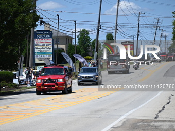 Bystanders are gathering for the funeral procession of Corey Comperatore in Sarver, Pennsylvania, United States, on July 19, 2024. The proce...