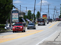 Bystanders are gathering for the funeral procession of Corey Comperatore in Sarver, Pennsylvania, United States, on July 19, 2024. The proce...