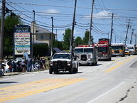 Bystanders are gathering for the funeral procession of Corey Comperatore in Sarver, Pennsylvania, United States, on July 19, 2024. The proce...