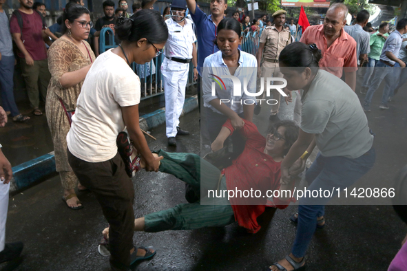 Police are detaining a student during a march by Activists of the Progressive Democratic Students Federation in a protest rally towards the...