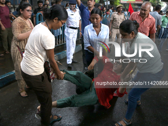 Police are detaining a student during a march by Activists of the Progressive Democratic Students Federation in a protest rally towards the...