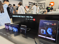 The Mi MIX Flip and MIX Fold 4 foldable phones are being displayed at the Xiaomi store in Tongling, China, on July 19, 2024. (