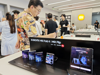 The Mi MIX Flip and MIX Fold 4 foldable phones are being displayed at the Xiaomi store in Tongling, China, on July 19, 2024. (