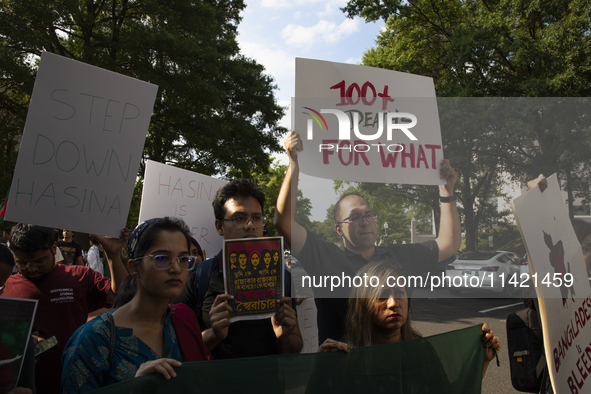 Demonstrators of the Bangladeshi community are showing signs with the words ''100+ Deaths For What'' among other informative texts during a...