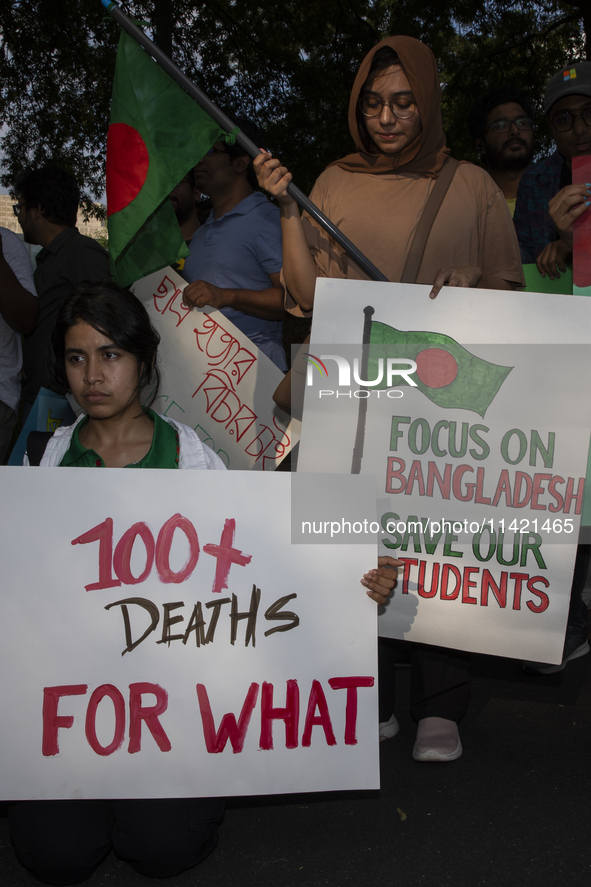 Demonstrators of the Bangladeshi community are displaying signs with the words ''100+ Deaths For What'' among other informative texts during...