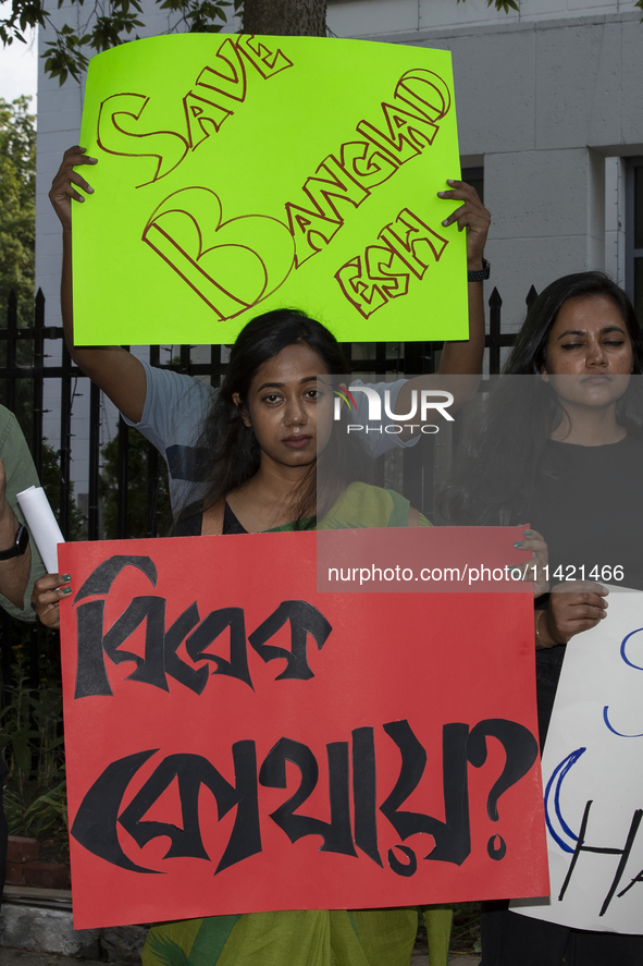 Demonstrators of the Bangladeshi community are displaying signs with the words ''Save Bangladesh'' among other informative texts during a ra...