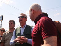 Kharkiv Mayor Ihor Terekhov and UN High Commissioner for Refugees Filippo Grandi (R to L) are being seen at the site of the aftermath of the...