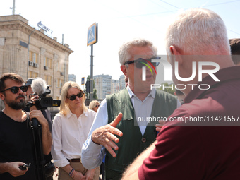 Kharkiv Mayor Ihor Terekhov and UN High Commissioner for Refugees Filippo Grandi (R to L) are being seen at the site of the aftermath of the...