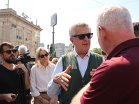 Kharkiv Mayor Ihor Terekhov and UN High Commissioner for Refugees Filippo Grandi (R to L) are being seen at the site of the aftermath of the...