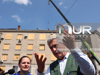 UN High Commissioner for Refugees Filippo Grandi is visiting the site of the aftermath of the Russian missile attack on a residential apartm...