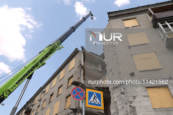 The aftermath of a Russian missile attack on a residential apartment building is unfolding in Kharkiv, Ukraine, on July 17, 2024. 