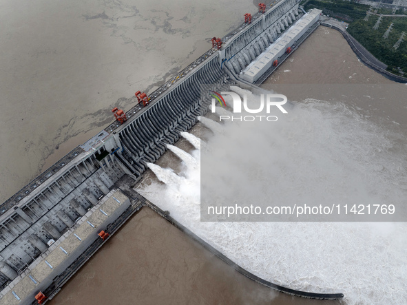 Floodwater is being released from seven drainage holes at the Three Gorges Hub of the Yangtze River in Yichang, China, on July 20, 2024. 