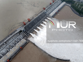 Floodwater is being released from seven drainage holes at the Three Gorges Hub of the Yangtze River in Yichang, China, on July 20, 2024. (