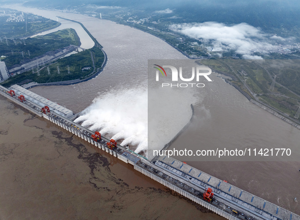 Floodwater is being released from seven drainage holes at the Three Gorges Hub of the Yangtze River in Yichang, China, on July 20, 2024. 