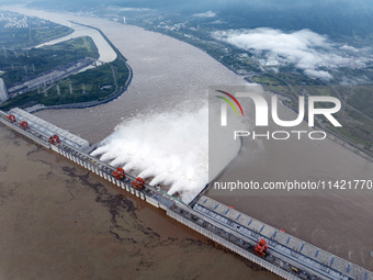 Floodwater is being released from seven drainage holes at the Three Gorges Hub of the Yangtze River in Yichang, China, on July 20, 2024. (