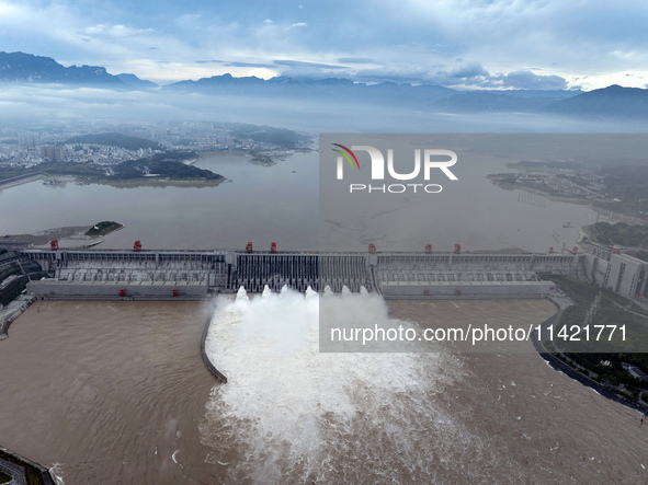 Floodwater is being released from seven drainage holes at the Three Gorges Hub of the Yangtze River in Yichang, China, on July 20, 2024. 