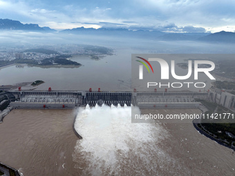 Floodwater is being released from seven drainage holes at the Three Gorges Hub of the Yangtze River in Yichang, China, on July 20, 2024. (