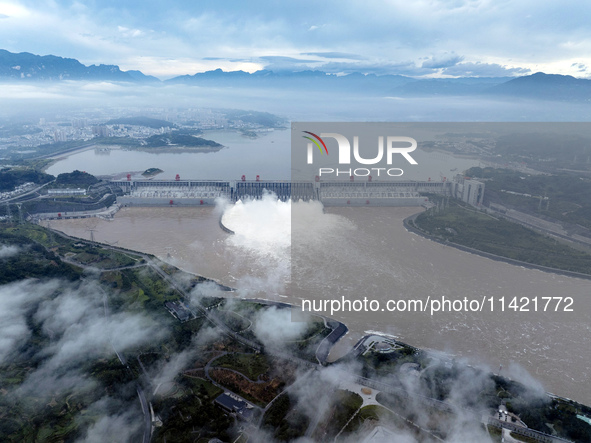 Floodwater is being released from seven drainage holes at the Three Gorges Hub of the Yangtze River in Yichang, China, on July 20, 2024. 