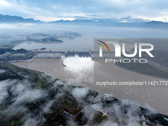 Floodwater is being released from seven drainage holes at the Three Gorges Hub of the Yangtze River in Yichang, China, on July 20, 2024. (