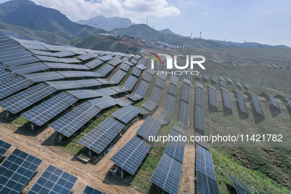 The barren mountains of the past are now filling with solar photovoltaics in Li Mawu Village, Yuncheng City, Shanxi Province, China, on July...