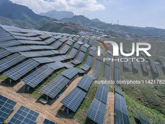 The barren mountains of the past are now filling with solar photovoltaics in Li Mawu Village, Yuncheng City, Shanxi Province, China, on July...