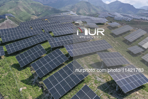 The barren mountains of the past are now filling with solar photovoltaics in Li Mawu Village, Yuncheng City, Shanxi Province, China, on July...