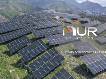 The barren mountains of the past are now filling with solar photovoltaics in Li Mawu Village, Yuncheng City, Shanxi Province, China, on July...