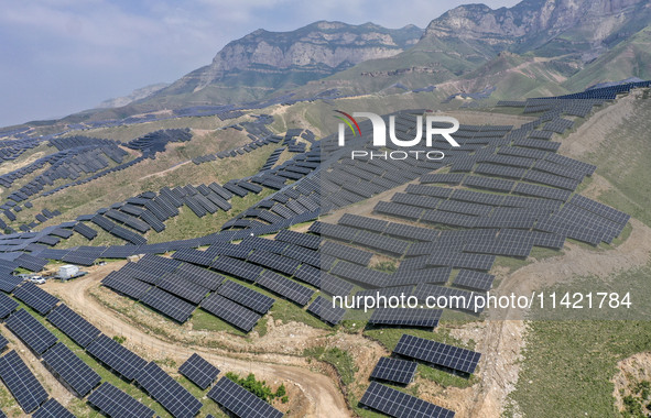 The barren mountains of the past are now filling with solar photovoltaics in Li Mawu Village, Yuncheng City, Shanxi Province, China, on July...