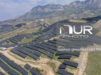 The barren mountains of the past are now filling with solar photovoltaics in Li Mawu Village, Yuncheng City, Shanxi Province, China, on July...