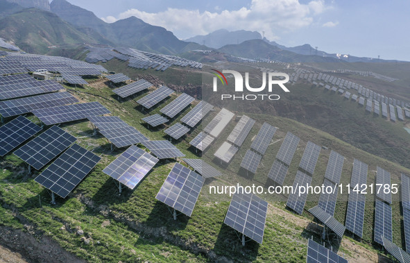 The barren mountains of the past are now filling with solar photovoltaics in Li Mawu Village, Yuncheng City, Shanxi Province, China, on July...