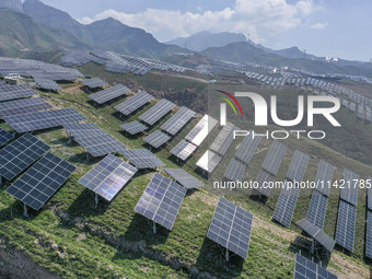 The barren mountains of the past are now filling with solar photovoltaics in Li Mawu Village, Yuncheng City, Shanxi Province, China, on July...