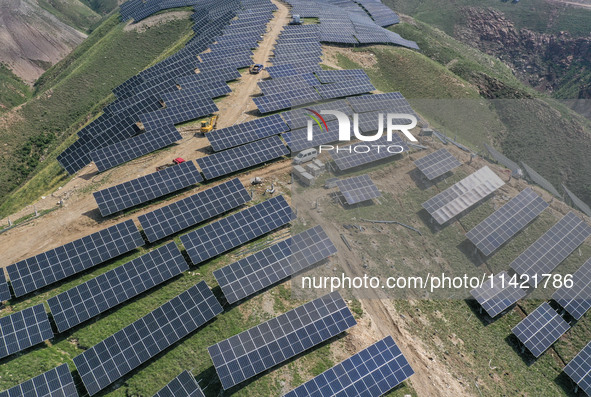 The barren mountains of the past are now filling with solar photovoltaics in Li Mawu Village, Yuncheng City, Shanxi Province, China, on July...