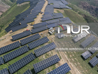 The barren mountains of the past are now filling with solar photovoltaics in Li Mawu Village, Yuncheng City, Shanxi Province, China, on July...