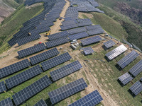 The barren mountains of the past are now filling with solar photovoltaics in Li Mawu Village, Yuncheng City, Shanxi Province, China, on July...