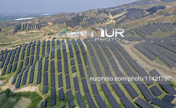 The barren mountains of the past are now filling with solar photovoltaics in Li Mawu Village, Yuncheng City, Shanxi Province, China, on July...